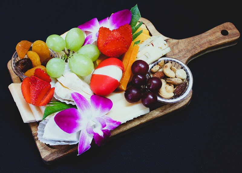 Cutting board with fruit and flowers