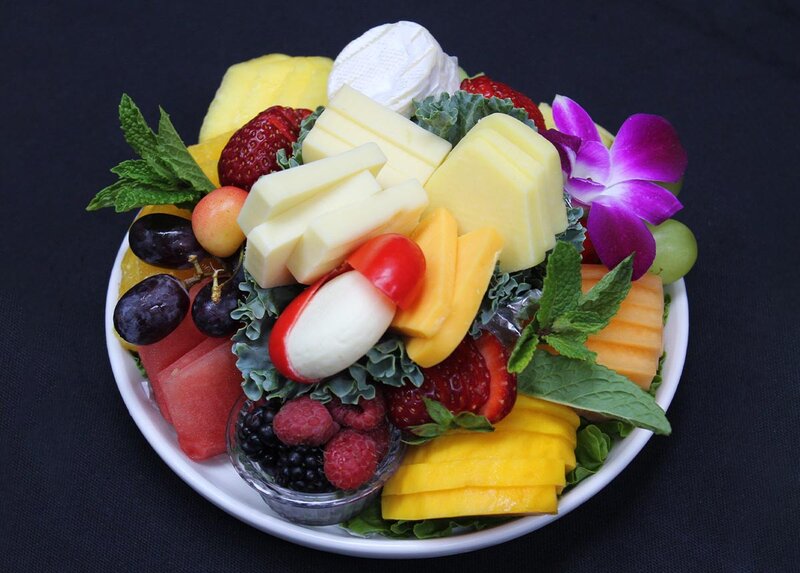 Round plate with fruit topped with flowers