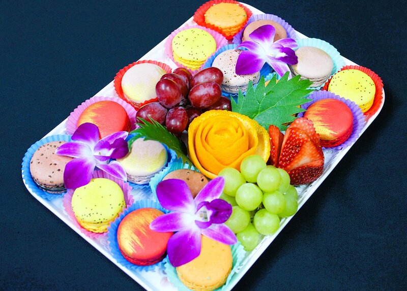 Fruit platter with grapes, strawberries, melon and macarunes