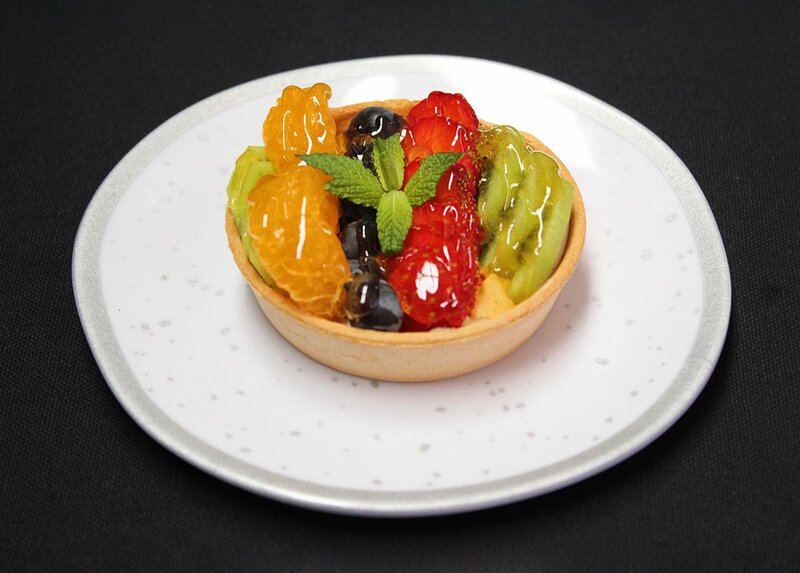 Fruit cup with strawberries, melon and kiwi
