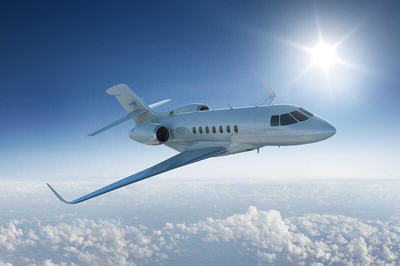 Small jet flying above the clouds