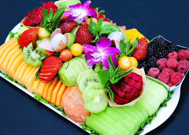 Fruit platter with berries, melon and kiwi